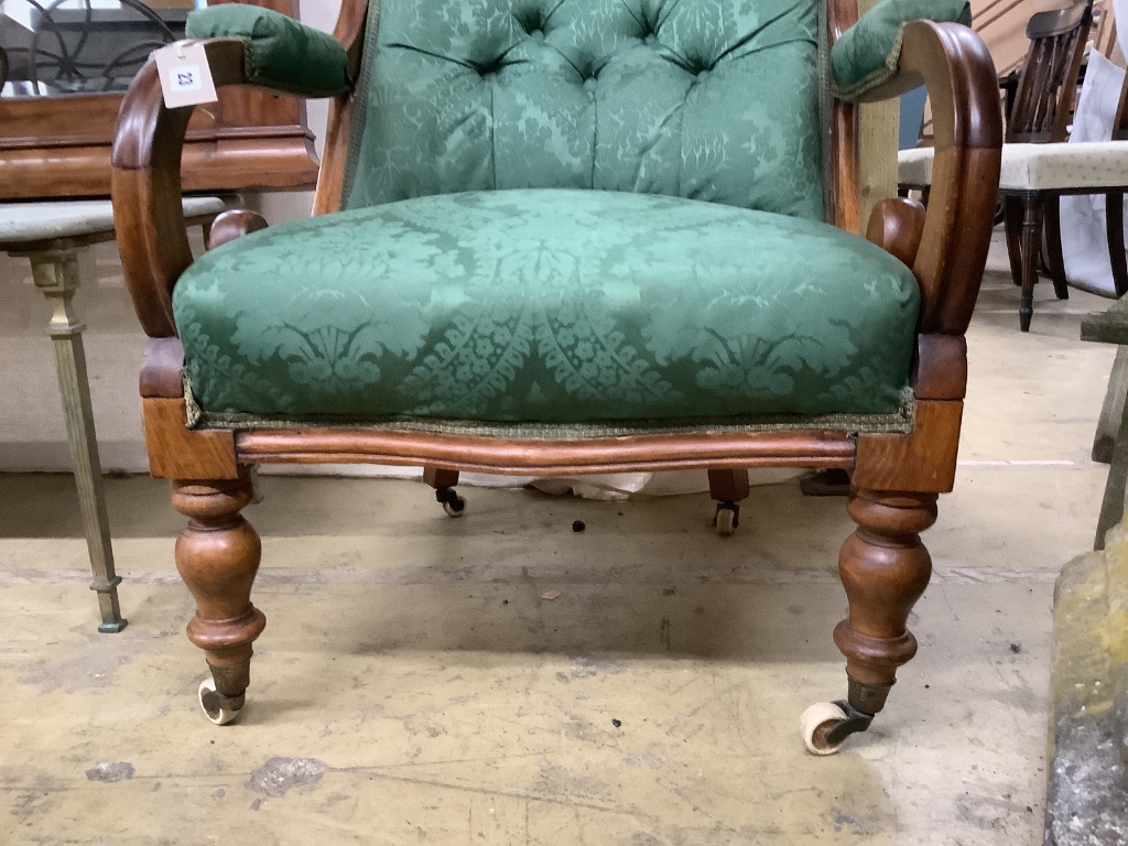 A mid Victorian upholstered mahogany armchair, width 66cm, depth 70cm, height 94cm